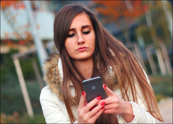 Woman using mobile phone.